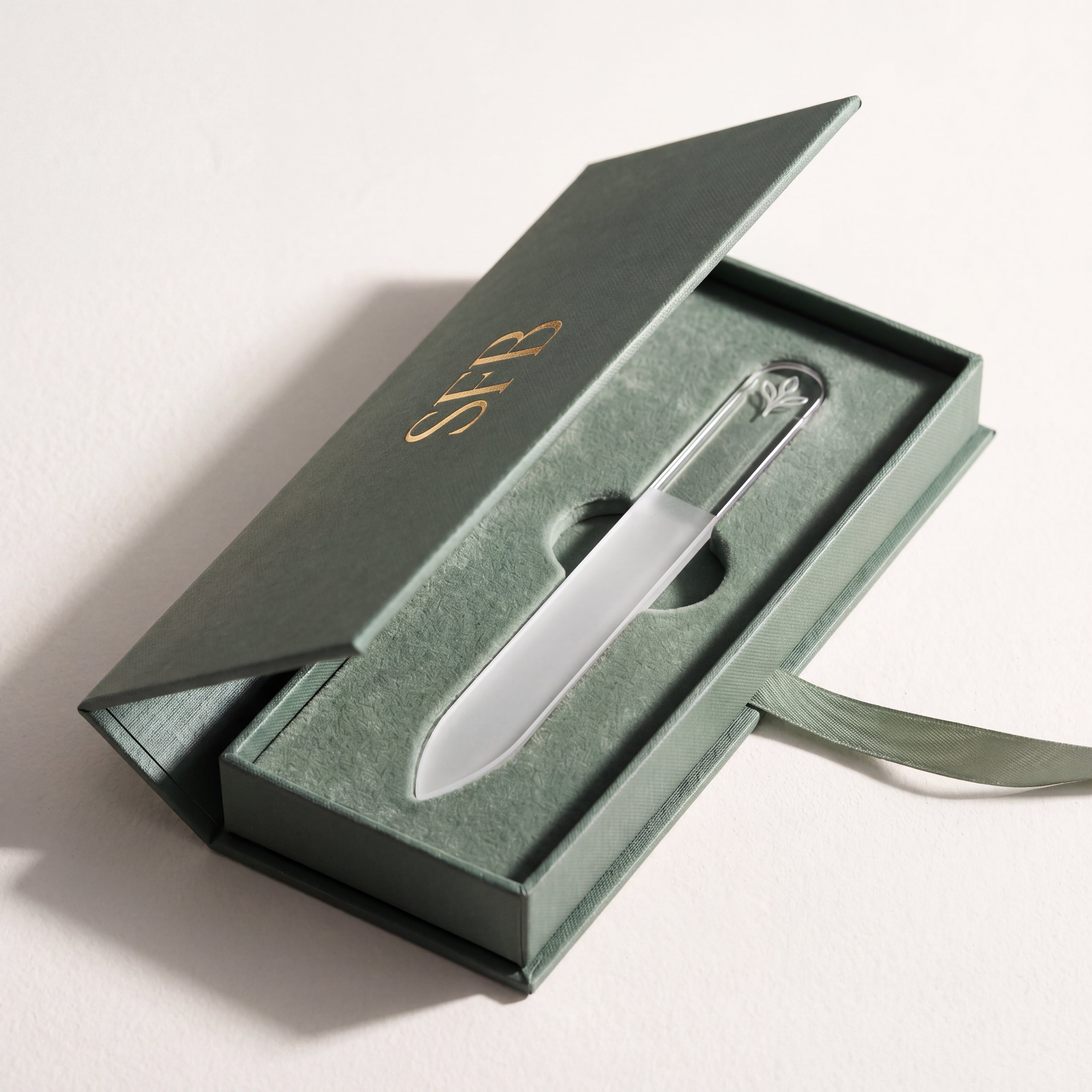 The Crystal File resting in its protective hard travel case, a Czech crystal glass nail file built for years of use